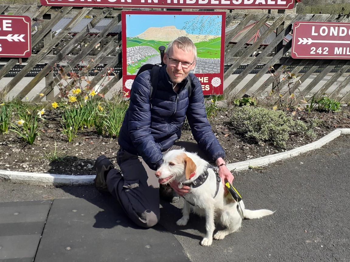John walking dogs on a sunny Collingham village lane